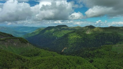 Wall Mural - aerial view of clouds over summer green mountains landscape, montenegro, 4k