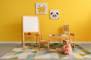 Wall Mural - Interior of playroom with toys and whiteboard in kindergarten