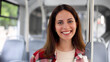 © PeopleVideos - Smiling young woman enjoying a bus ride