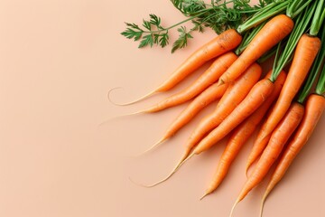 Wall Mural - Fresh Carrots on a Peach Background