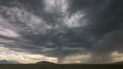Wall Mural - Time lapse of storm moving over Utah Lake during summer monsoon.