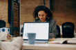 © Daria - Group of female managers sitting in open office while working on digital tablet and laptop
