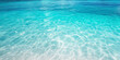 © Denniro - Clear turquoise water surface. Close-up view of pristine turquoise water with sun reflections creating patterns on the surface