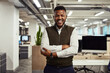 © NonVig/peopleimages.com - Portrait, intern and black man in office with arms crossed, smile and confidence. Startup, company and new job opportunity for growth with positivity and consulting agency employee with happiness.
