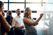© NonVig/peopleimages.com - Office, pregnant woman and writing in whiteboard on workshop for planning and idea as project manager. Leader, teamwork and collaboration as employees with mission, solution and strategy for business