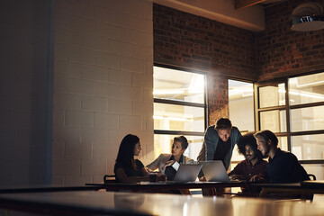 Poster - Business people, meeting and journalists with laptop for planning and brainstorming news blog. Writers room, team and tech for article research, feedback and lead generation in office at night