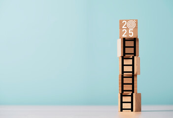 Wall Mural - 2025 with dartboard and arrow on the top of ladder and copy space for setup and enhance business ach