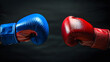© Oleksandr - two boxing gloves fighting each other on black background. one blue and the another red