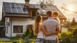 © Артур Комис - a family looks at a house with solar panels. Selective focus
