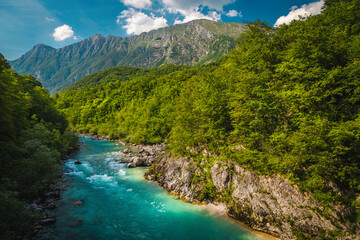 Wall Mural - Soca river and high mountains in background, Kobarid, Slovenia