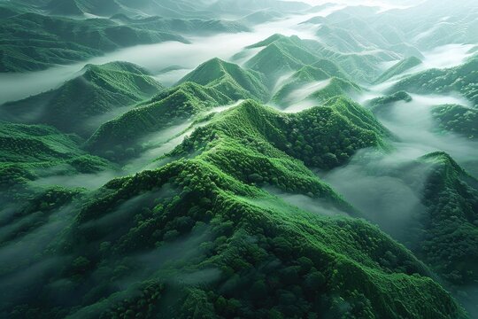 Breathtaking aerial view of lush green mountains and misty clouds creating a serene and majestic landscape in the early morning light.