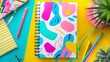 © DonChanu - A colorful cartoon patterned notebook with a vibrant cover and lined pages for jotting down thoughts and ideas, Generative AI