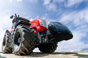 Poster - Modern red agricultural tractor bottom view.