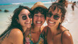 © Sawyer0 - Three women smiling and posing for a photo on the beach. Their happy faces and casual gestures suggest that they are enjoying their time spent on the beach.