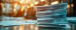 © CHONCHANOK PHOTO - Stack of papers on a desk with blurred background.