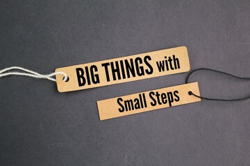 paper tags with inspirational words big things with small steps