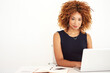 © peopleimages.com - African woman, laptop and portrait in studio by space for mock up with typing by white background. Person, computer and promotion with planning, research or notebook for online job at creative agency
