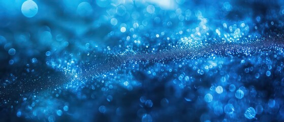 Wall Mural - A bright blue bokeh background with blurred lights, creating a festive and colorful atmosphere suitable for Christmas designs