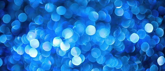 Wall Mural - A bright blue bokeh background with blurred lights, creating a festive and colorful atmosphere suitable for Christmas designs