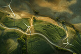 aerial view of a wind farm with turbines spinning