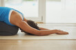 © peopleimages.com - Yoga, stretch meditation and woman in home for health, wellness and mindfulness exercise. Pilates, zen chakra and calm yogi for spiritual training, holistic workout or peace in apartment living room