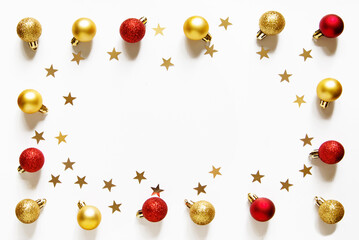 Wall Mural - christmas and new year composition with christmas red and gold balls and gold confetti stars. light 