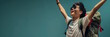 © MarGa - A joyful young Asian man with a backpack celebrating travel and adventure