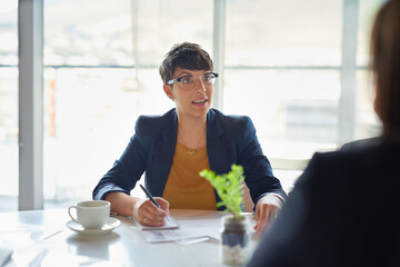 Fototapete - Notes, talking or businesswoman in meeting, discussion or collaboration for company or growth. Teamwork, review or budget analyst in office planning for writing, feedback report or project funding