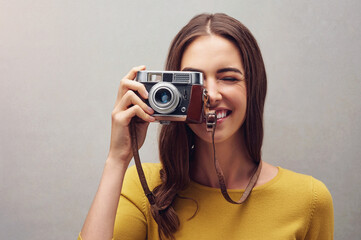 Canvas Print - Woman, portrait and vintage camera with photographer in studio with smile, lens and retro with artist. Happiness, aesthetic and professional journalist for newspaper company with elections in America