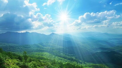 Wall Mural - Dazzling sunlight illuminates wild mountain scenery with clear blue sky white clouds and sunbeams shining on hills and trees