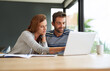 © peopleimages.com - Home, couple and laptop for finance, income and planning for budget, accounting or research for life insurance. Internet, apartment or man with woman, computer or conversation for investment or email