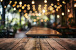 © Ivan - empty wooden table and blurred bokeh lights at the back of a cafe or bar with space for product, text or inscriptions. Copy space wooden table coffee