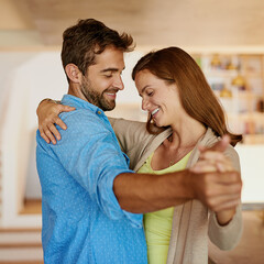 Canvas Print - Happy couple, dancing and together in kitchen for wellbeing, happiness for anniversary or date. Man, woman and movement in home with support and music, partners with commitment and hug for wellness