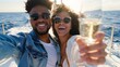 © LukaszDesign - Summer romantic vacationers aboard yacht toast with champagne. Happy young man with expensive wine on ship cruise with girlfriend for celebration or honeymoon.