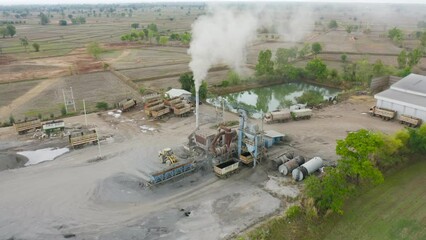 Wall Mural - Aerial top view of ground in the land with sand in factory industry for construction site. Arid pattern texture background. Bulldozer tractor