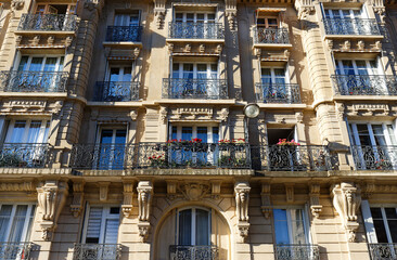 Wall Mural - The facade of traditional French house with typical balconies and windows. Paris.