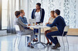 © peopleimages.com - Planning, meeting and businesspeople with black woman leader, discussion and teamwork in office. Collaboration, lawyer team and diversity for attorney, strategy or brainstorming for law firm employee