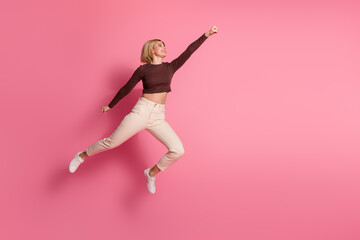 Sticker - Photo of lovely nice funny girl wear trendy brown clothes look empty space isolated on pink color background