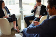 © Cecilie S/peopleimages.com - Check, watch or businessman in meeting, discussion or collaboration for teamwork or growth. Appointment, time management or financial manager in office planning for loan, feedback report or project