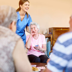 Poster - Women, nurse and laughing patient with playing cards for games, fun and happy at nursing home. People, caregiver and smile with bonding for care, support and trust in healthcare for entertainment