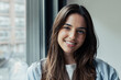 © Daniel - Head shot portrait confident positive woman with healthy toothy smile looking at camera, standing near window, successful happy businesswoman entrepreneur student posing for profile picture.