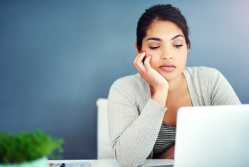 Poster - Business woman, bored and tired on computer reading, working or thinking of copywriting ideas. Sad worker, editor or online writer with fatigue on laptop and wall background for creative project