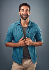 Poster - Fashion, jacket and smile with portrait of man in studio on gray background for relaxed clothing style. Casual, confident and denim shirt with happy person in clothes outfit to model wardrobe