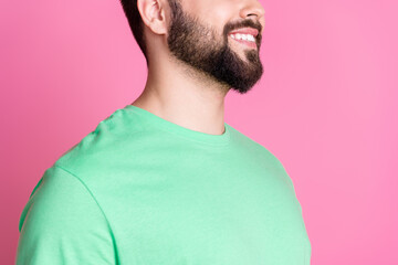 Wall Mural - Close up photo of toothy beaming guy with stylish beard dressed green t-shirt demonstrate stubble isolated on pink color background