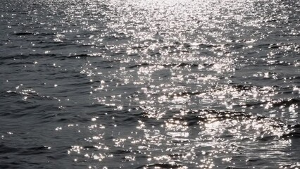 Wall Mural - Moving water surface with light reflections on the lake, Abstract background, Graphic elements, Mondsee, Salzkammergut, Austria, Europe