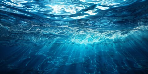 Wall Mural - A close-up photo of blue ocean waves from underwater, with sunlight shining down