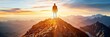 © pham - A solitary man stands on a rocky mountaintop, silhouetted against a vibrant sunrise. The view stretches across a vast expanse of mountains, showcasing a breathtaking landscape