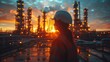© Cintarsih - Engineer Overlooking Industrial Plant at Twilight. A powerful scene of an engineer overlooking a sprawling industrial plant illuminated by twilight, symbolizing industry and innovation.