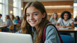 © Aliaksandra - Teenager Close up face of school girl looking at camera while studying on computer. Portrait of smiling young woman student using laptop in university library with classmates