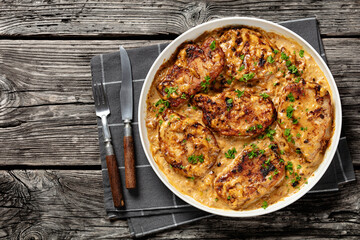 Wall Mural - creamy smothered pork chops cooked in onion gravy